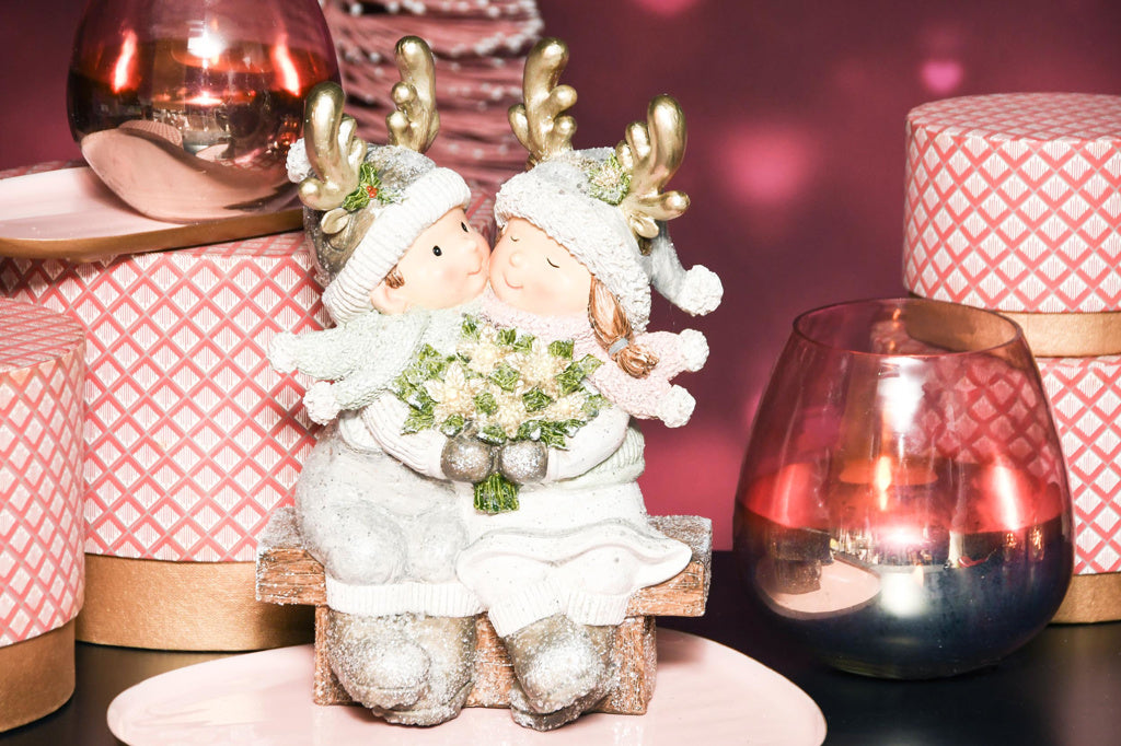Kerstkindjes op een bankje